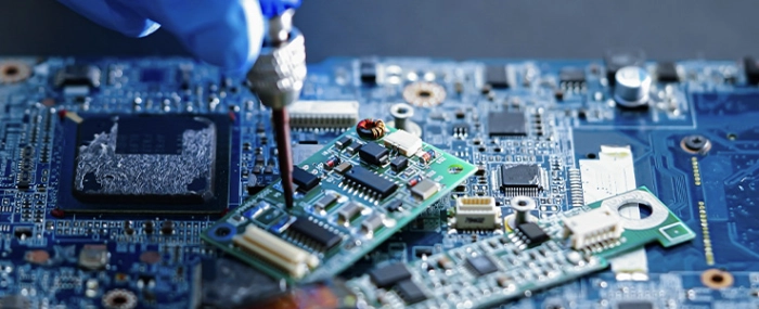 man-tinkering-components