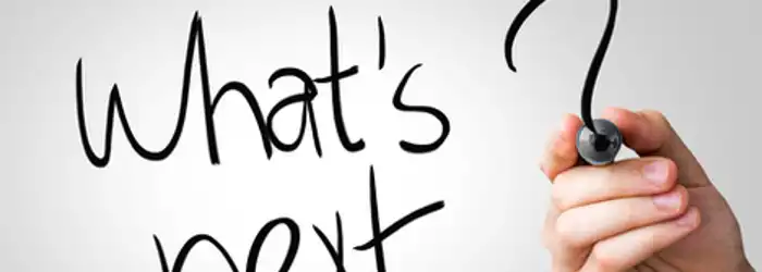 _whats-next-hand-writing-with-a-marker-on-transparent-board